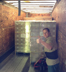 Andy unloading skids of 2UPCC14 4x6 Print Packs for SnapLab UPCX1